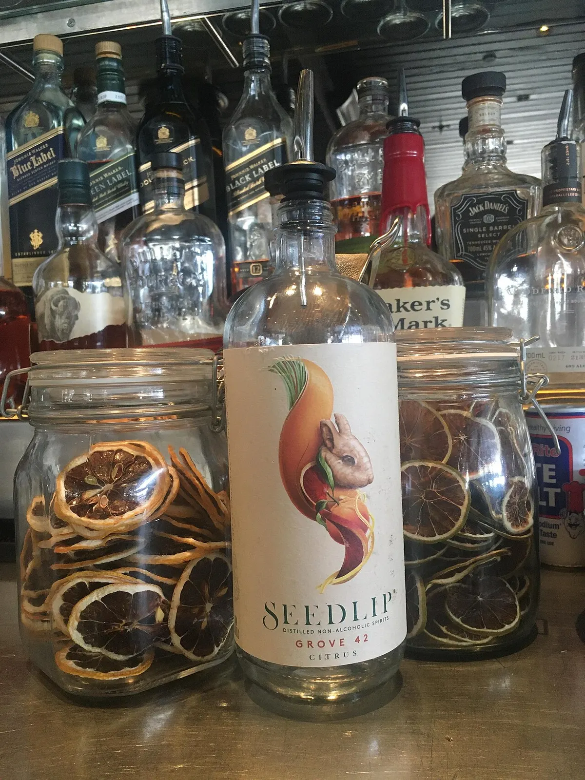 Bottle of Seedlip non-alcoholic spirit on a bar counter